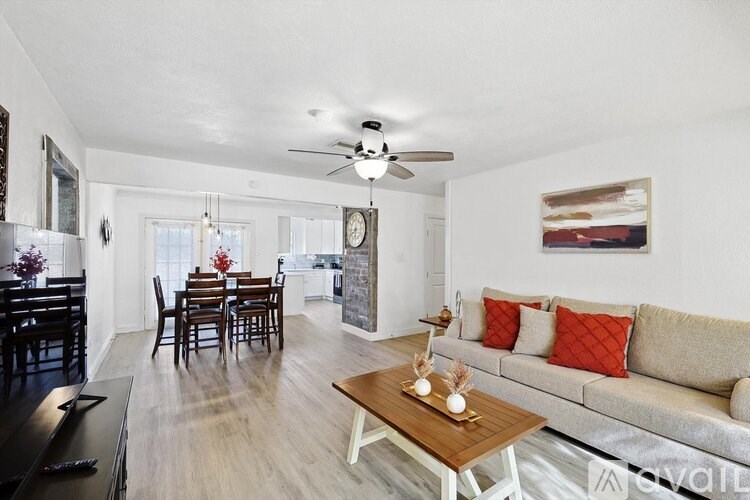 A living room with a piano and a couch.