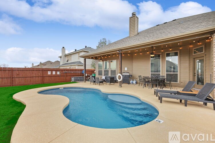 A house with a pool in the backyard.