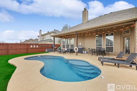 A house with a pool in the backyard.