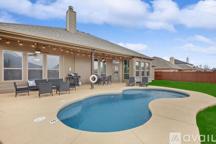 A house with a pool in the backyard.