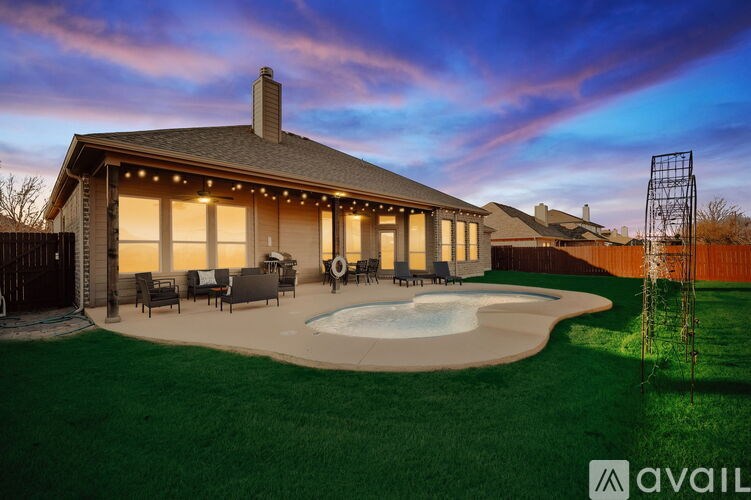 A house with a pool in the backyard.