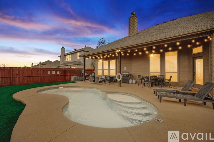 A house with a pool and patio furniture is available for rent.