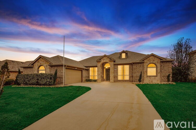 A house with a driveway leading to the front door.
