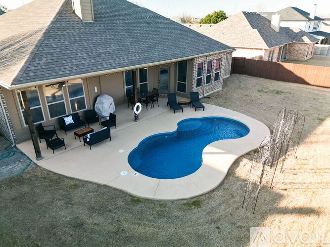 A house with a pool in the backyard.