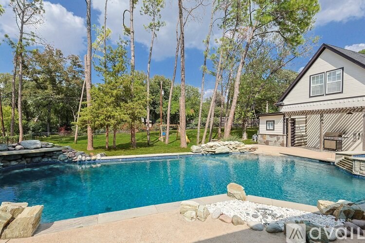 A house with a pool in the backyard.