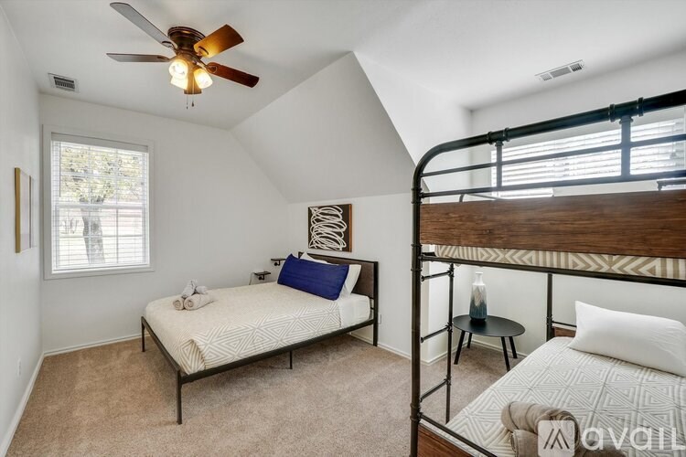 A bedroom with a bunk bed and a single bed.