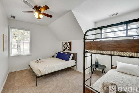 A bedroom with a bunk bed and a single bed.
