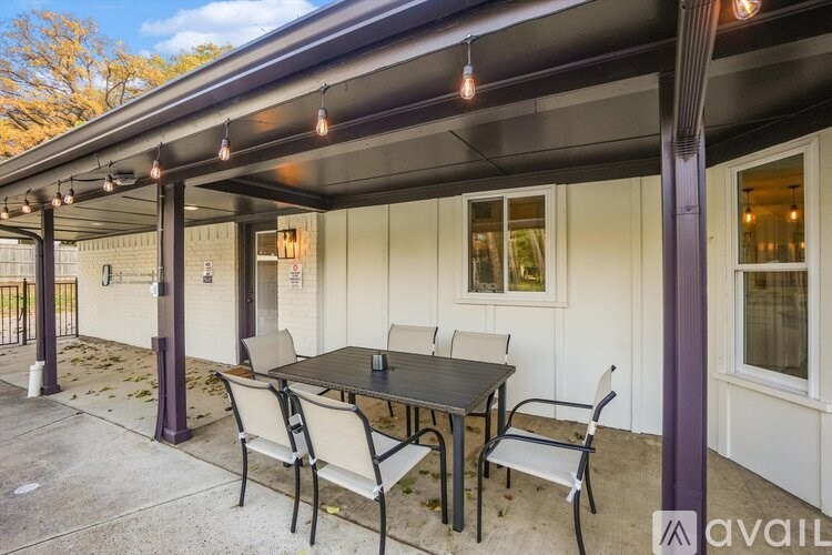 A patio with a table and chairs is available for rent.
