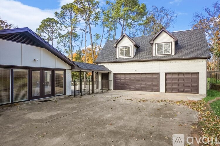 A two-story house with a garage is available for rent.