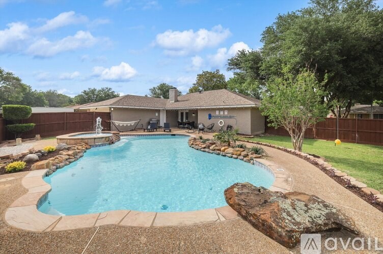A house with a pool in the backyard.