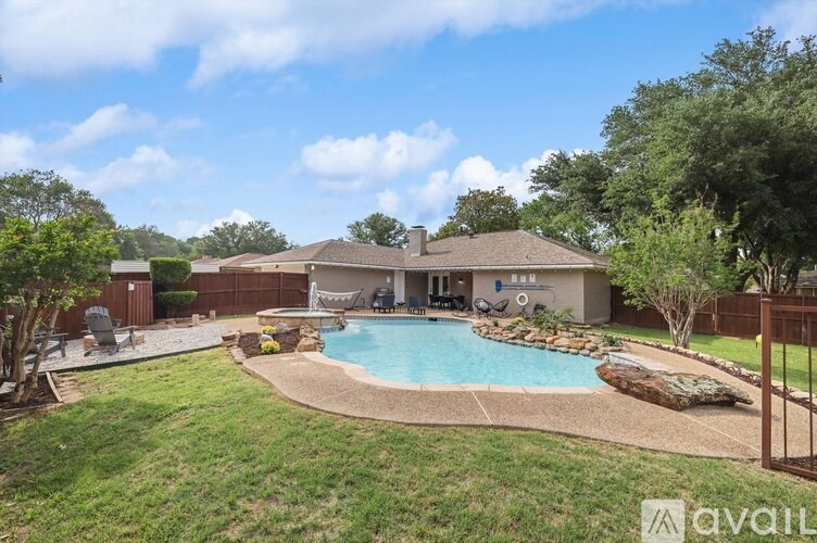 A house with a pool in the backyard.