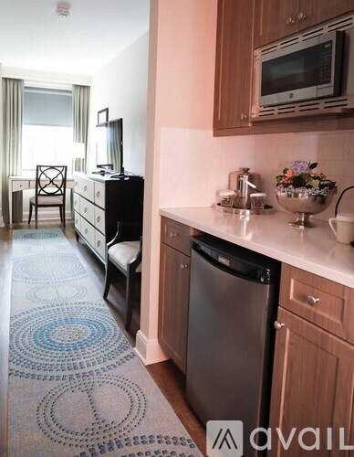 A kitchen with a dishwasher and a microwave.