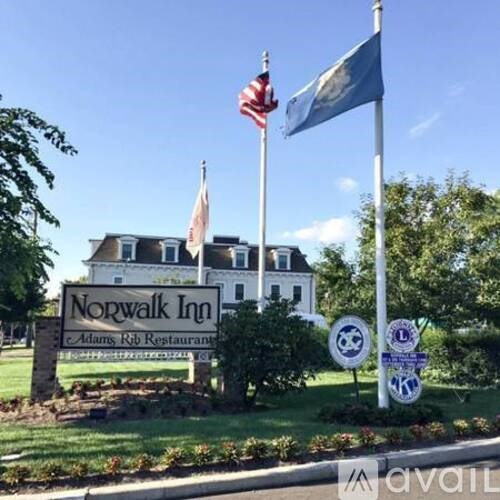 The Norwalk Inn sign is displayed in front of a building.