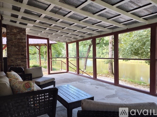 A patio with a couch, chairs, and a table is available for rent.