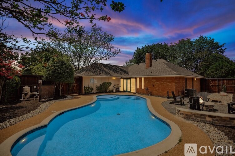 A house with a pool in the backyard.