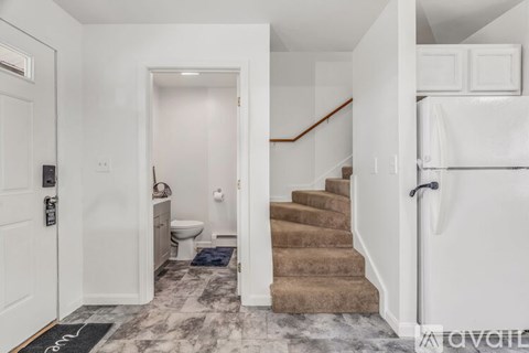 A long hallway with a door at the end.