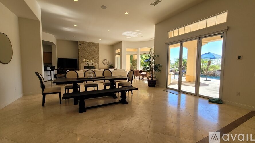 A living room with a sofa set and a television.
