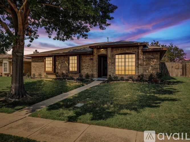 A house with a tree in front of it.