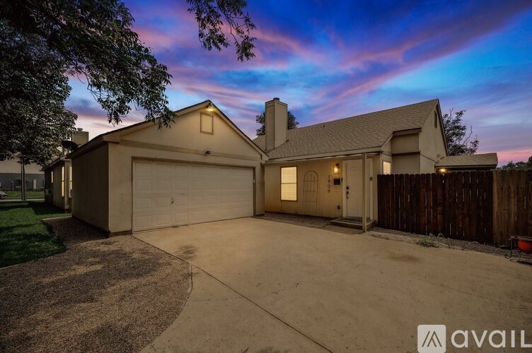 A house with a garage is available for sale.