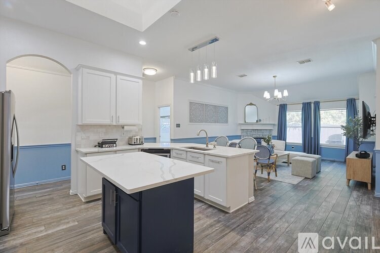A modern kitchen with a large island in the center.