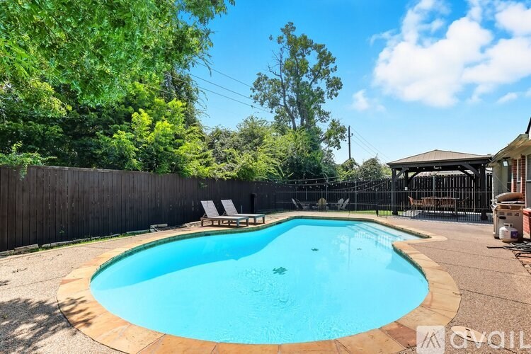 A house with a pool in the backyard.