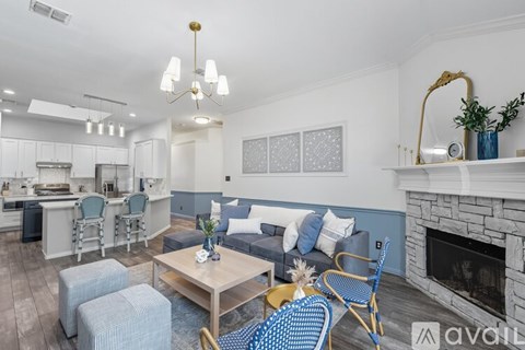 A dining room with a wooden table and chairs.