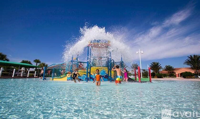 People are enjoying a water slide at a water park.