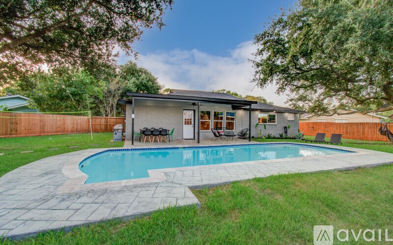 A house with a pool in the backyard.