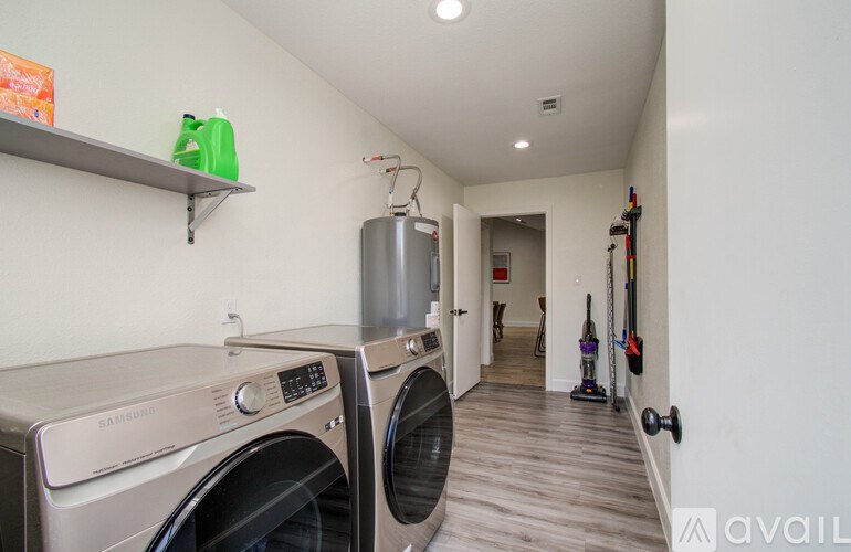 A laundry room with a washer and dryer.