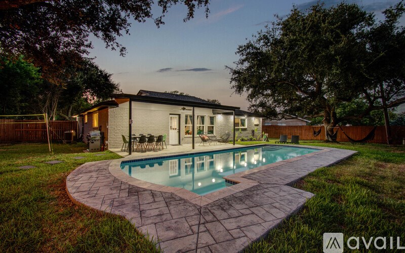 A house with a pool in the backyard.