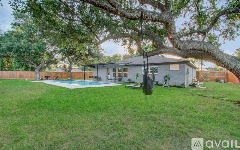A house with a tree in front of it.