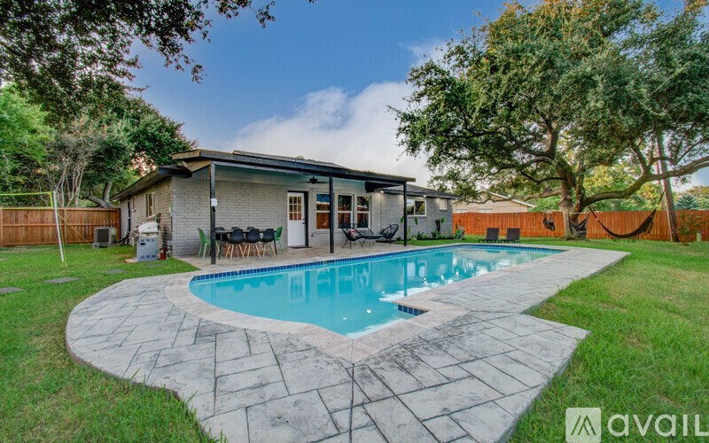 A house with a pool in the backyard.