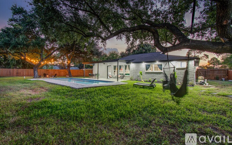 A house with a pool in the backyard is available for rent.