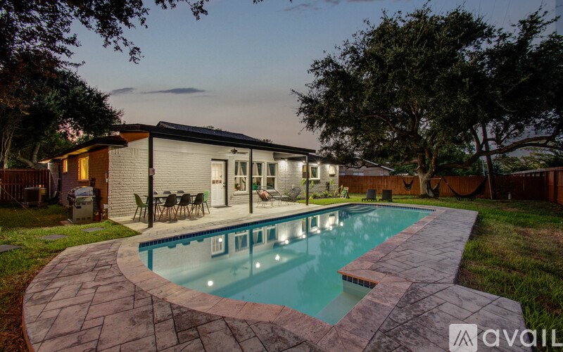 A house with a pool in the backyard.