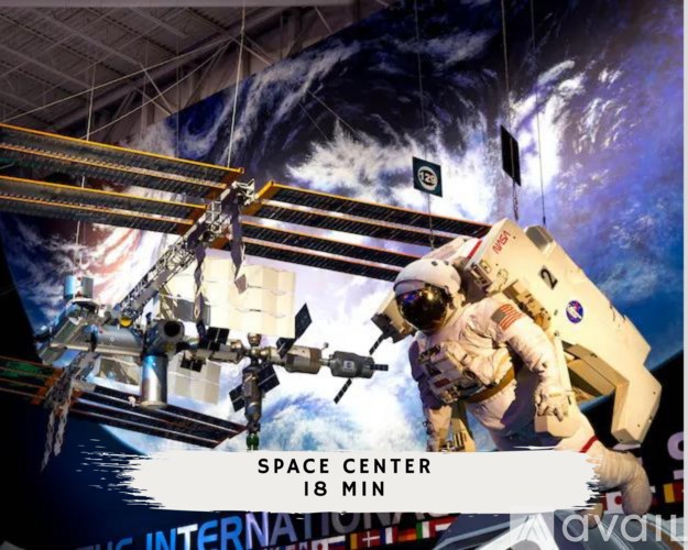 An astronaut is seen in a space suit in a space center.