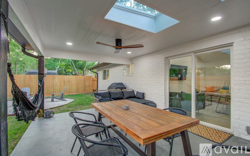 A patio with a table and chairs is shown.