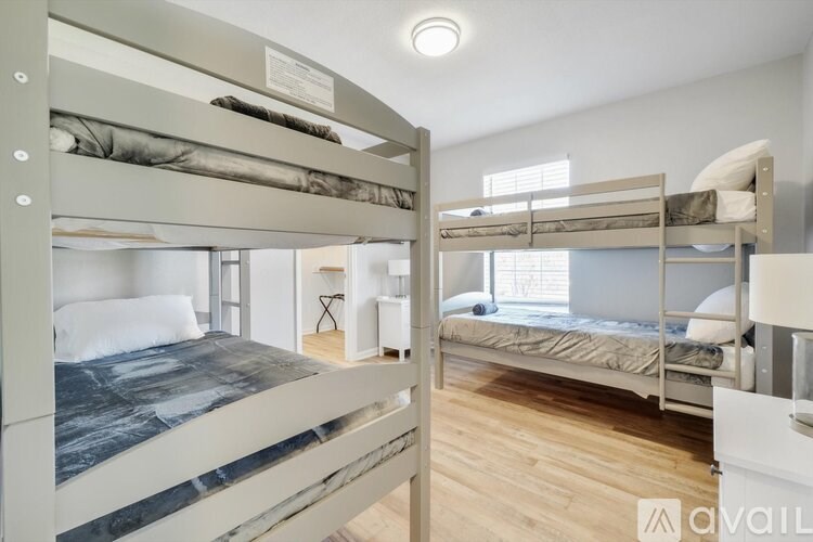 A room with bunk beds and a marble bed in the foreground.