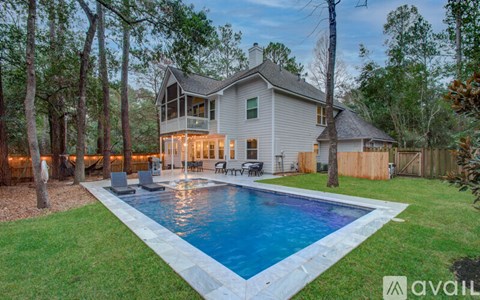 A house with a pool in the backyard.
