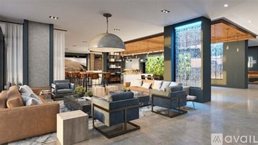 A modern living room with a large sectional sofa and a coffee table.