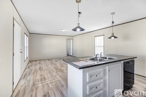 A kitchen with a sink and a dishwasher.