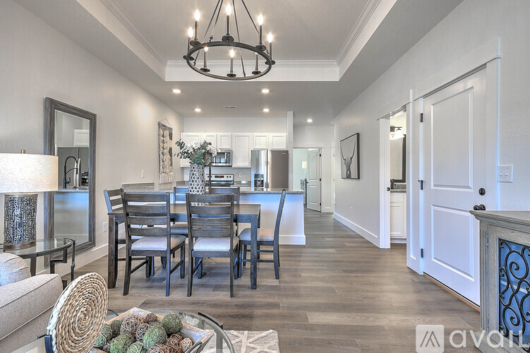 A dining room with a table set for six.