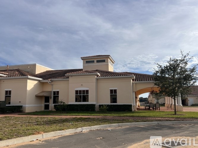 A building with a beige facade and a brown roof.