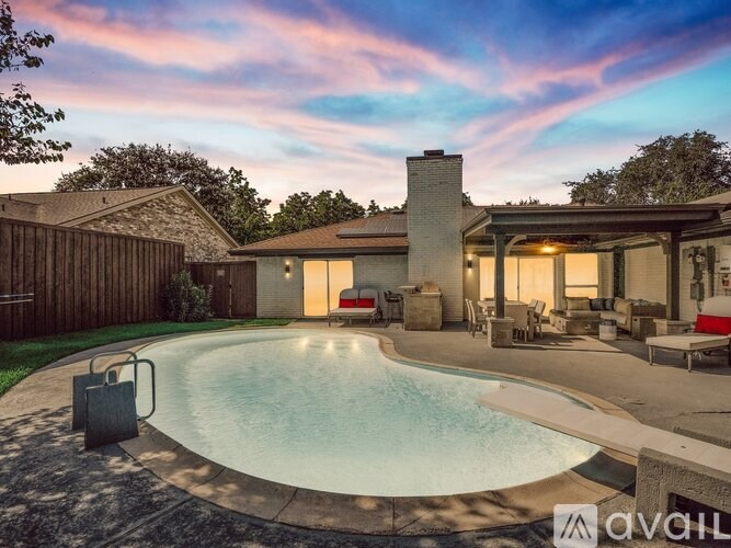 A house with a pool in the backyard.