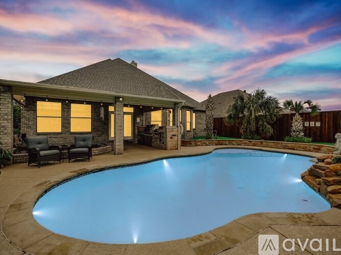 A house with a pool in the backyard.