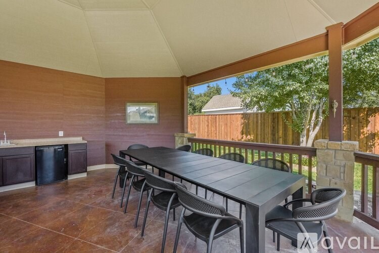 A patio with a table and chairs is available for rent.