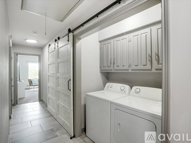 A laundry room with a washer and dryer in it.
