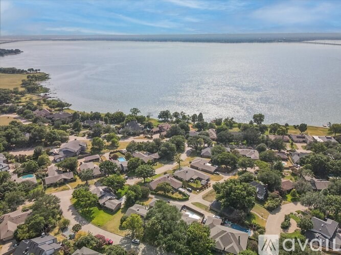 A bird's eye view of a residential area with houses and trees.