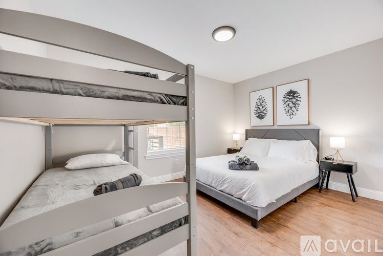 A bedroom with a bunk bed and a single bed.