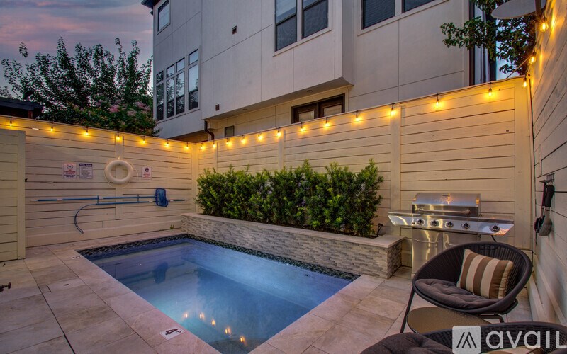 A backyard with a pool and a hot tub.