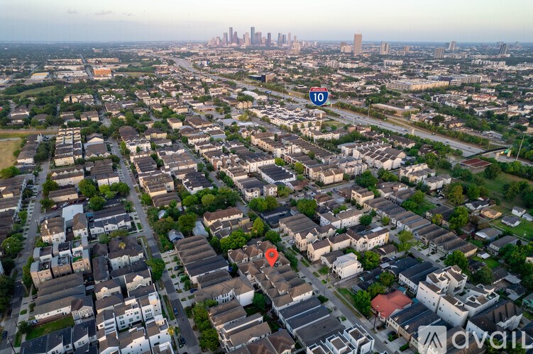 A red marker is placed on a house in a residential area.